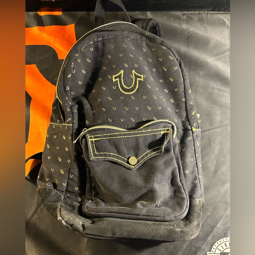 Black & gold true religion back pack